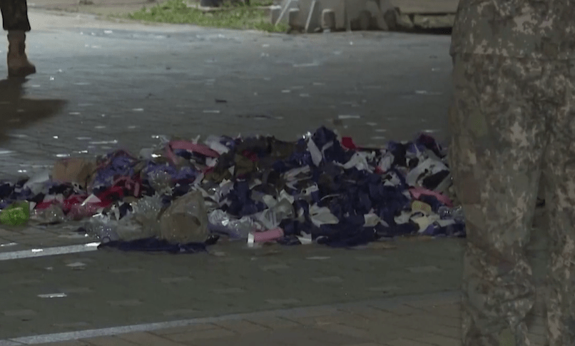 Bits of paper, plastic bottles and pieces of fabric could be seen among the trash