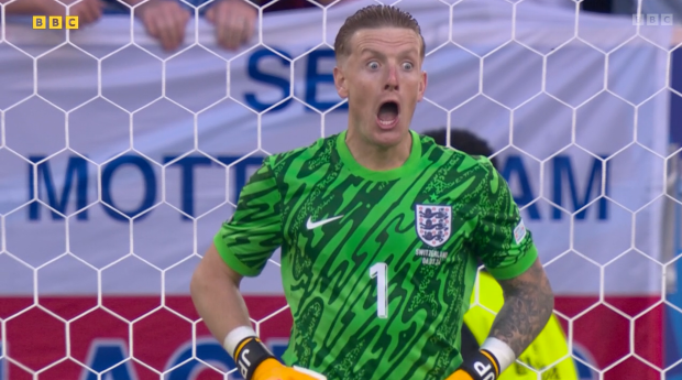 Jordan Pickford tries to put off a Switzerland player during the penalty shootout