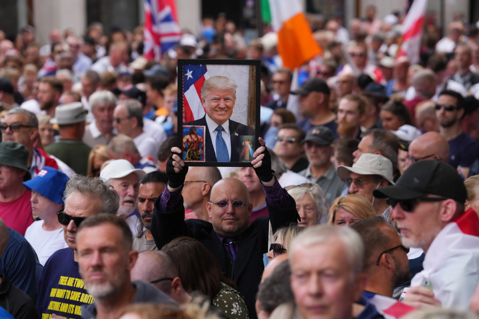 One man at the weekend protest held up a picture of Donald Trump