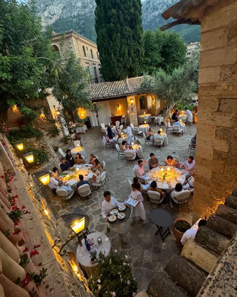 The couple have been enjoying the district of Deía, with Michelle showing the lovely romantic dinner setting with candlelit tables.