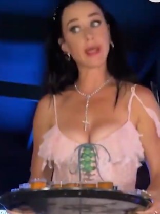 Katy was seen dancing and handing out shots at a club in Barcelona