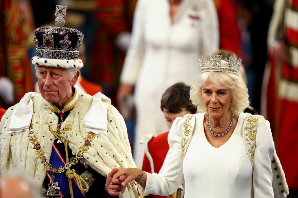 King Charles and Queen Camilla proceed through the House of Lords