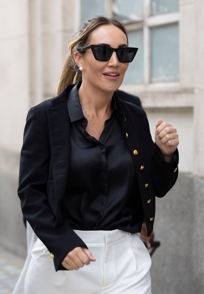 a woman wearing sunglasses and a black jacket