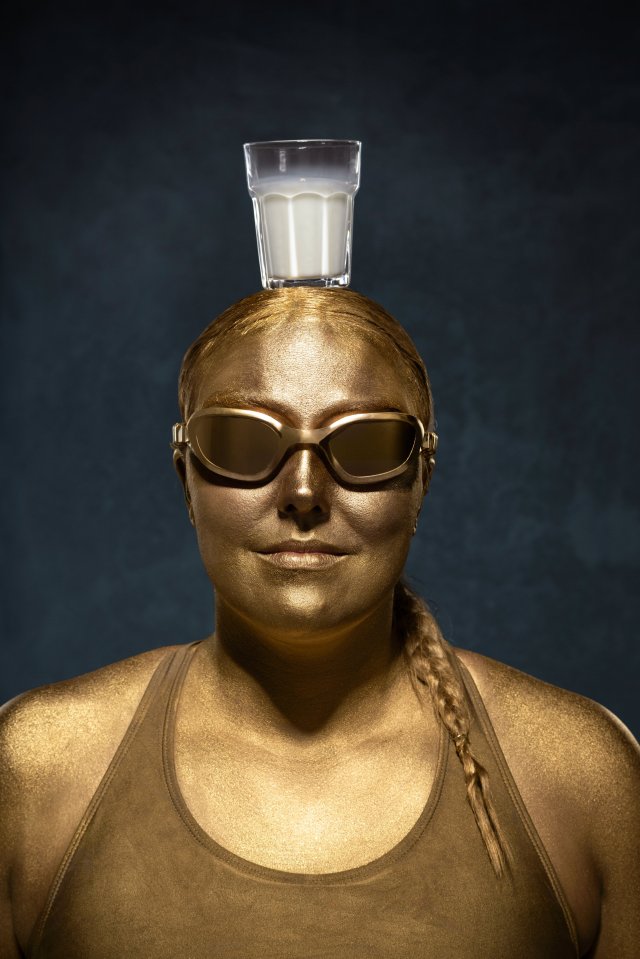 It looks like swimming isn't Faye Roger's only talent as she balances a glass of milk on her head.