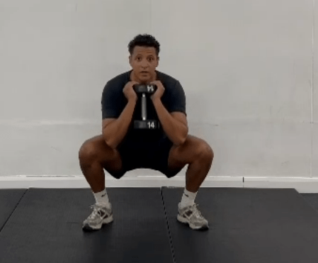 Grab the heaviest dumbbell you can mange and drop into a squat