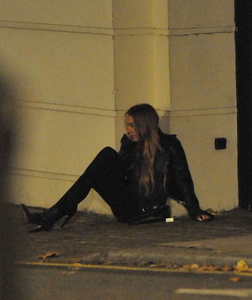 Lindsay sits on the street after a night out in 2008