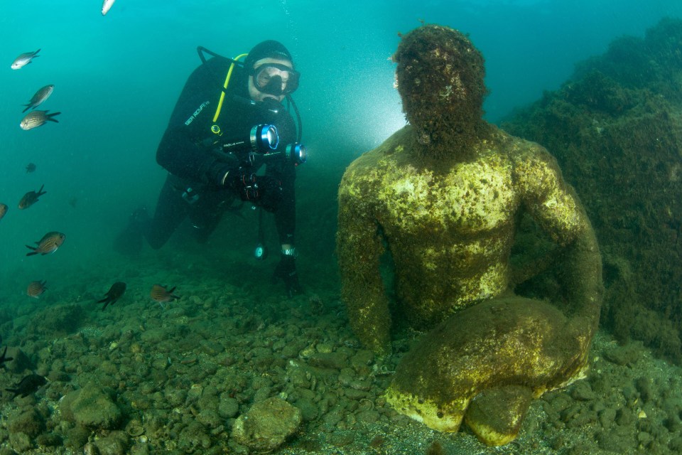 The underwater city still has many of statues sitting below the surface