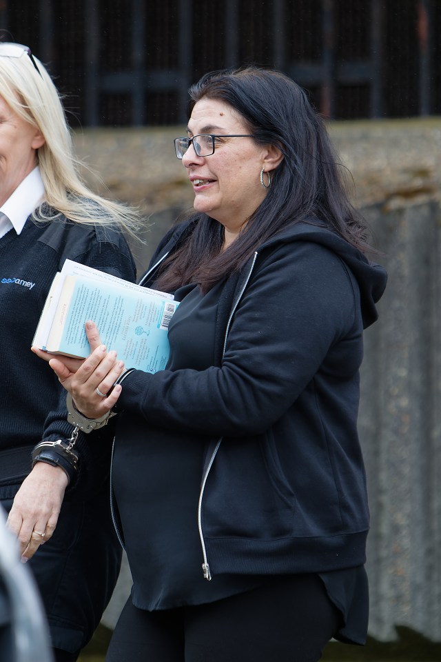 Lucy Adcock is escorted into a prison van after sentencing today