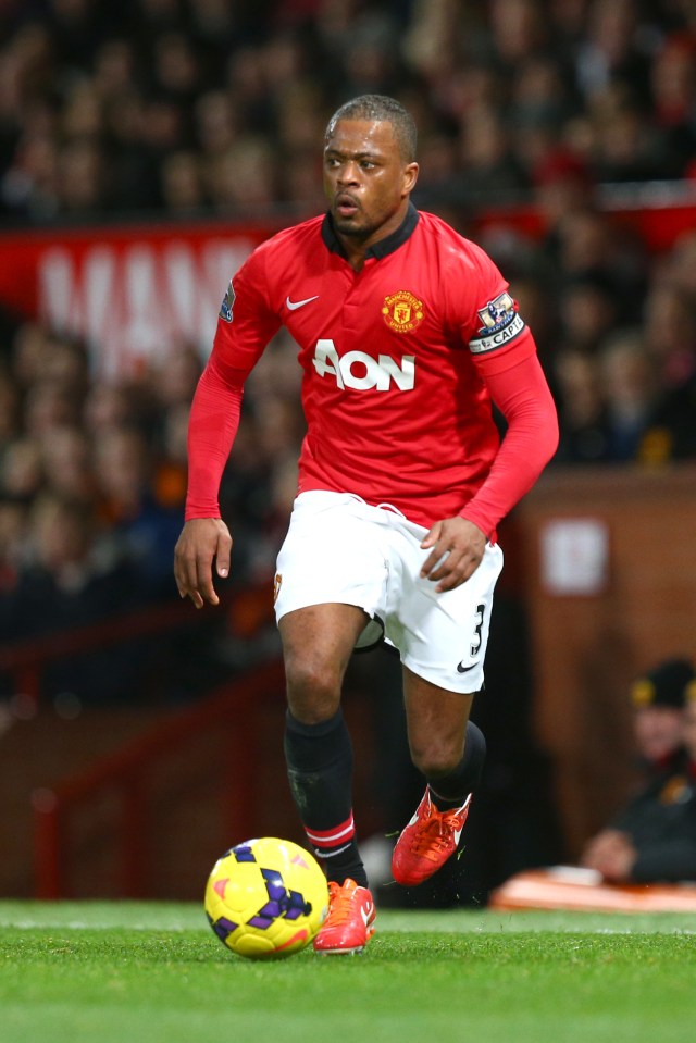 a soccer player wearing a red jersey with aon on it