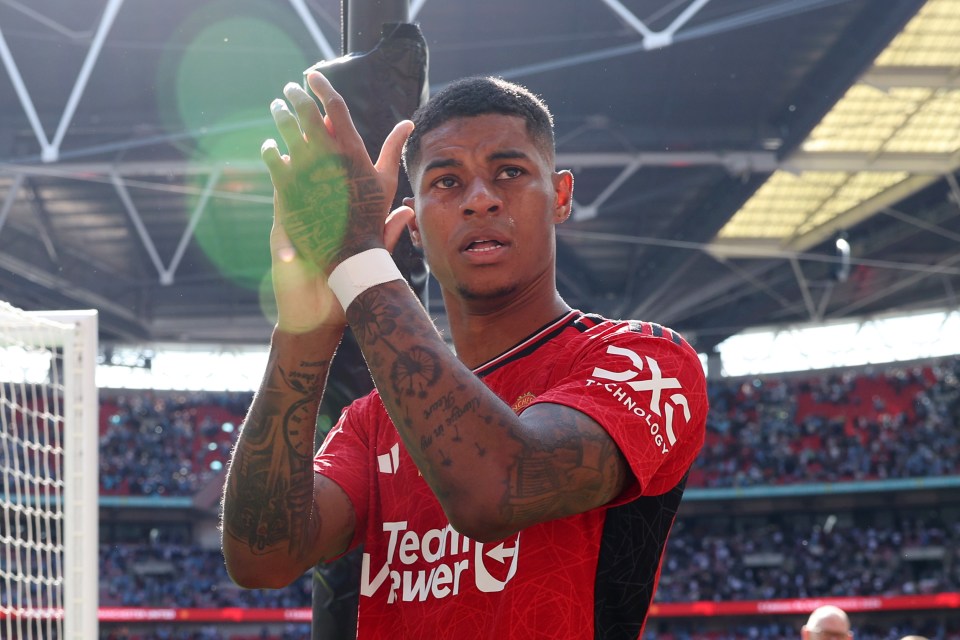 a soccer player wearing a red teamviewer jersey