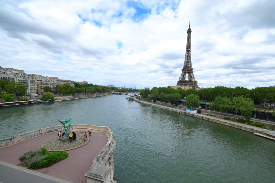 a view of the eiffel tower from across the river