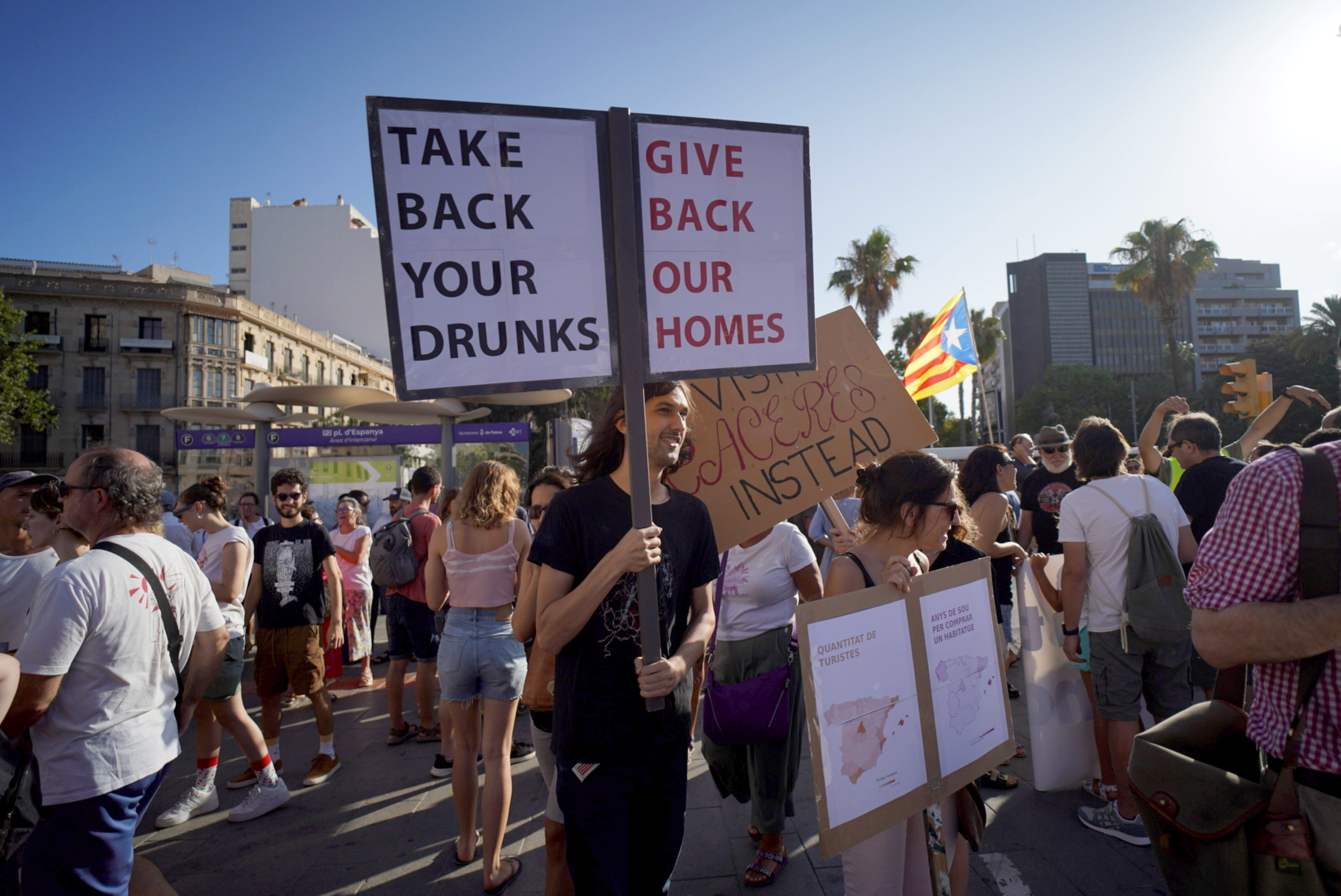 One sign at the protest reads 'TAKE BACK YOUR DRUNKS GIVE BACK OUR HOMES'