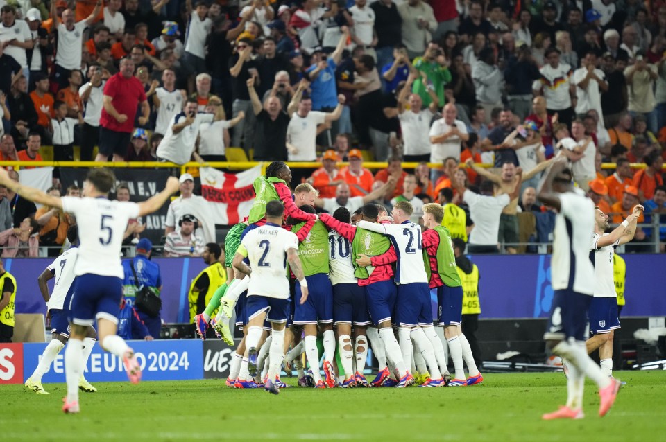 soccer players on a field with a sign that says euro 2024