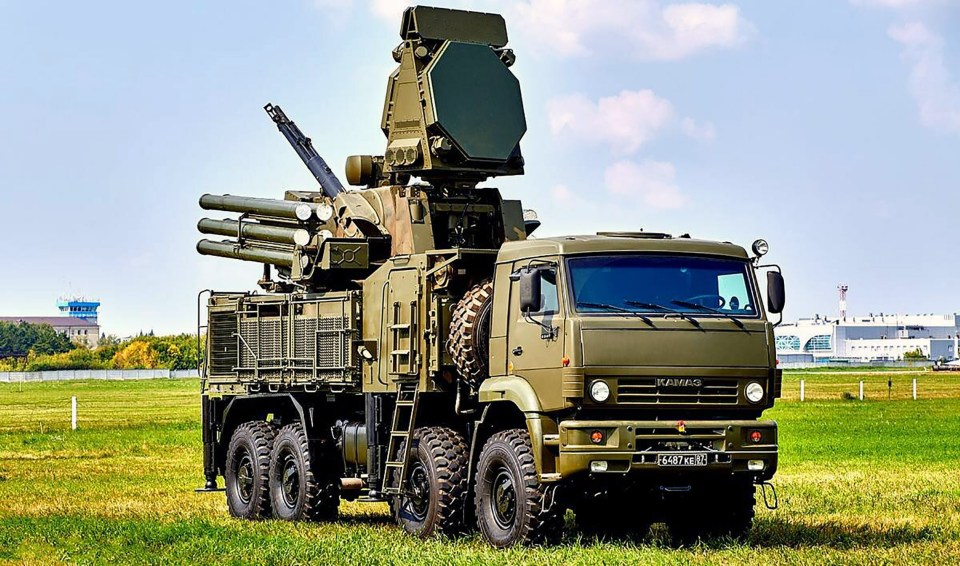 A Pantsir-S1 close-range air defence system - similar to this one - was seen at the top of the tower near Vlad's home