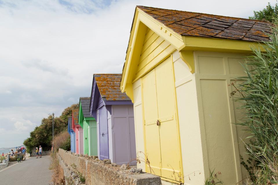 The promenade from Sandgate to Kent has lots of colourful beach huts too