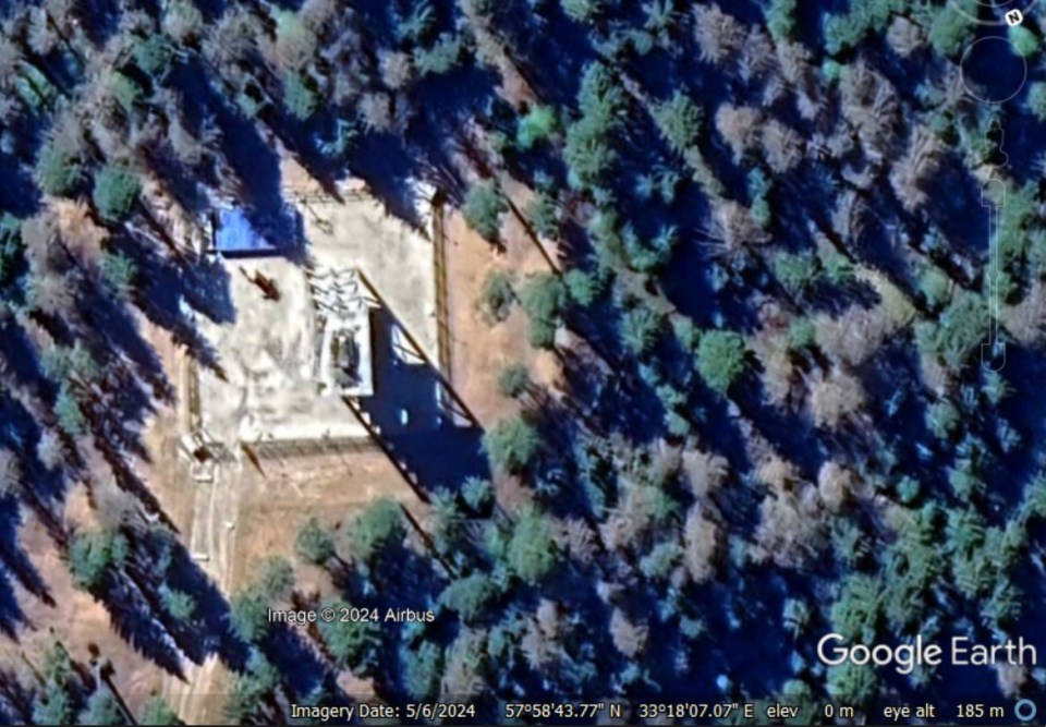 Another air defence system can be seen at a separate base in a forested area