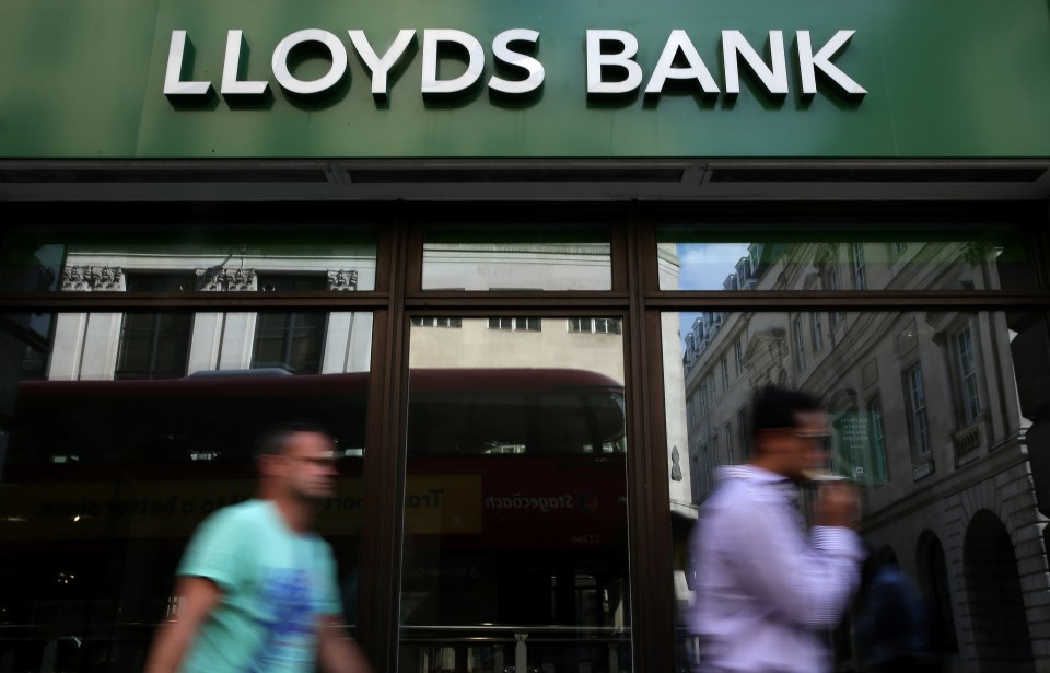 Pedestrians walk past a branch of a Lloyds bank (stock image)