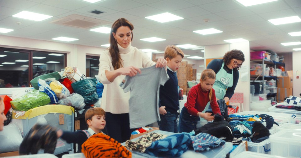 Prince George, Princess Charlotte and Prince Louis helped Kate at a Baby Bank sorting Christmas gifts for children in need last year