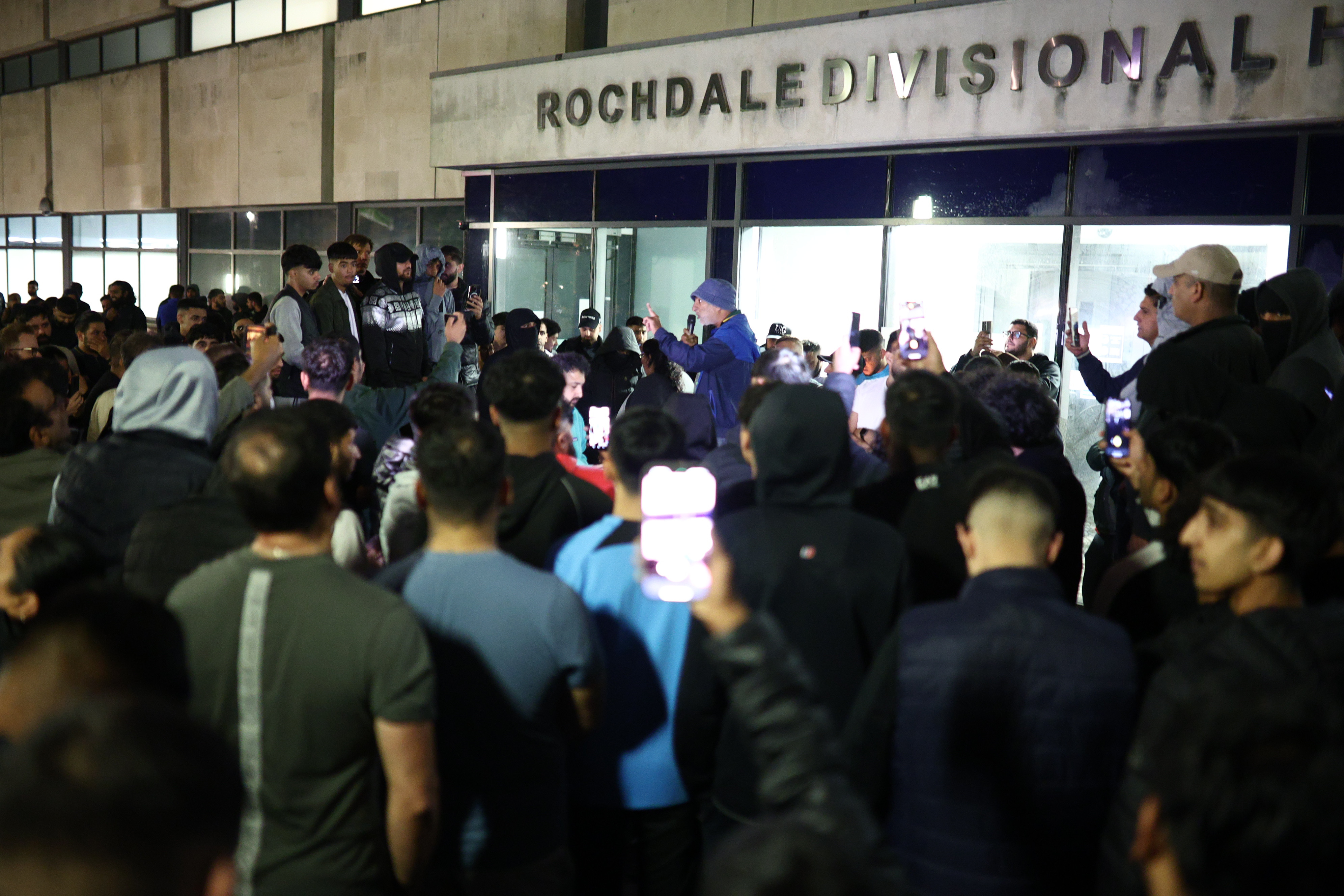 Protesters gather outside Rochdale police station on Thursday night after the video was shared widely online