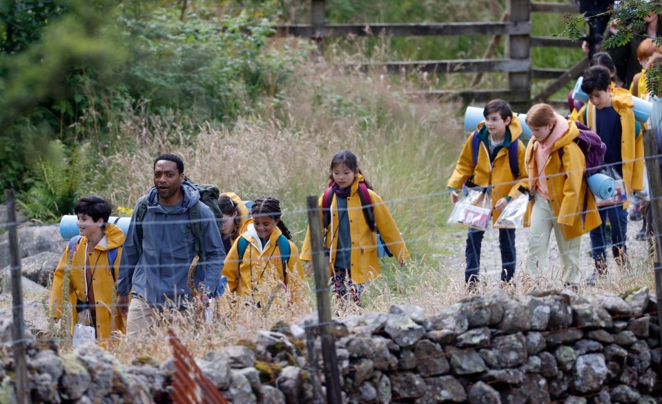 Chiwetel was seen leading the children