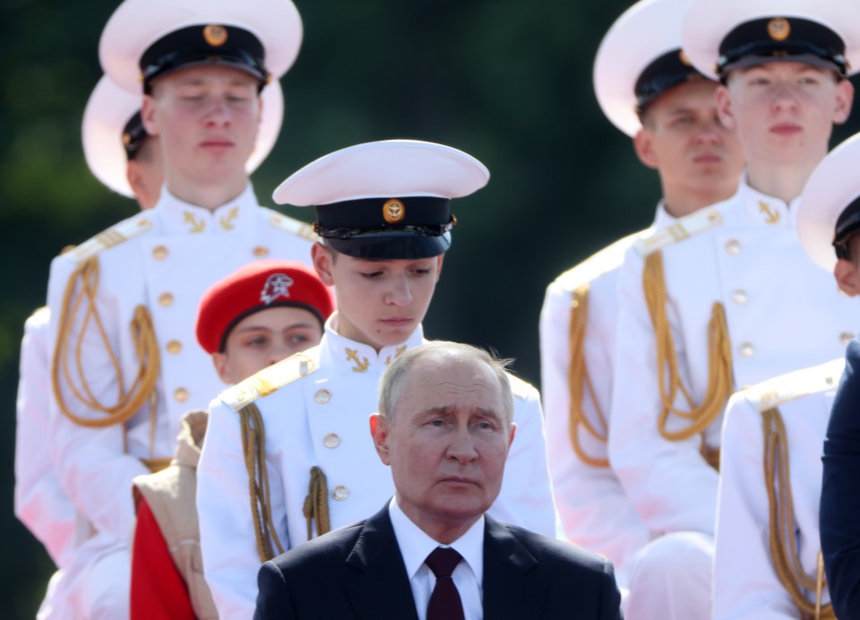 Vladimir Putin was present at Navy's Day parade as his country took another humiliating blow