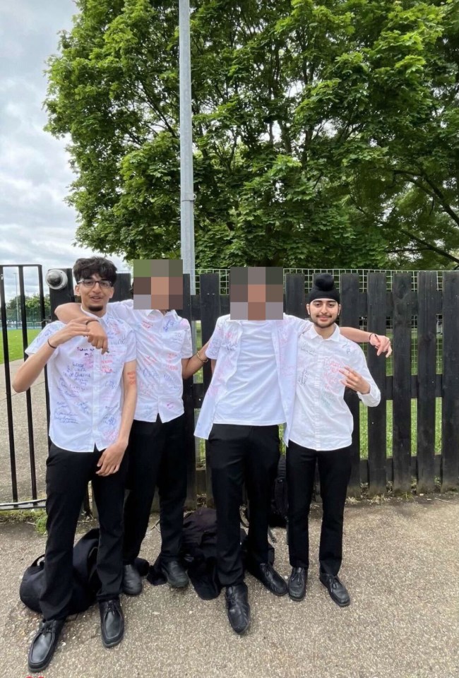 a group of young men wearing white shirts with messages on them