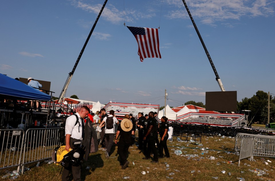 People file out of the rally grounds after the shooter's attack