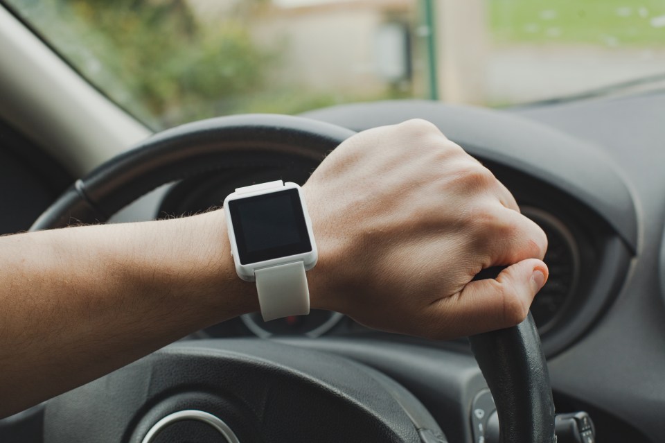 You could find yourself in hot water for using your smartwatch at the wheel