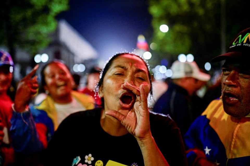 Supporters of Maduro celebrate after results were released