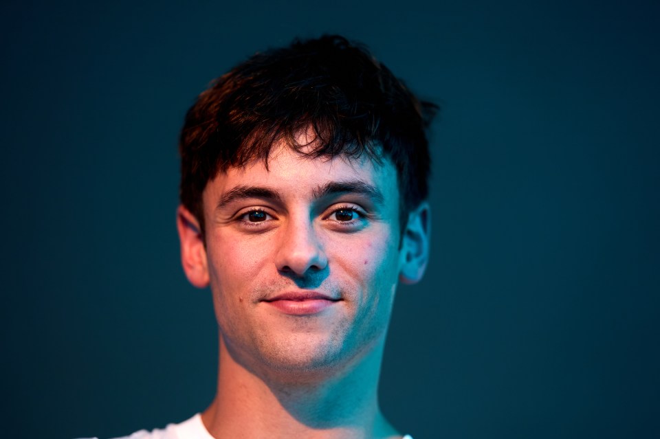 a close up of a man 's face with a blue background