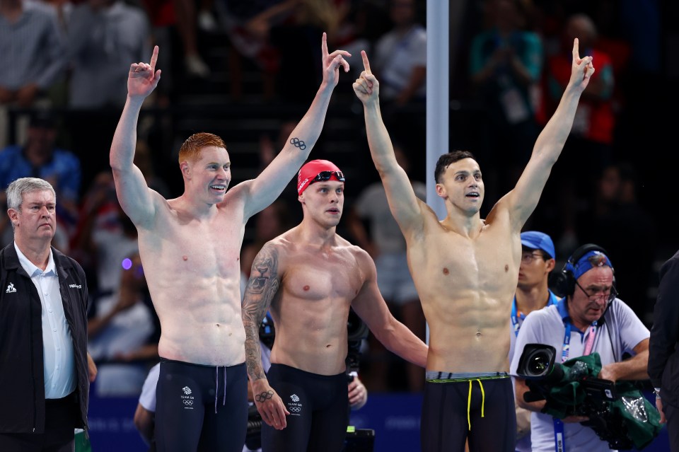 a group of athletes with one wearing a red cap that says ' rio ' on it