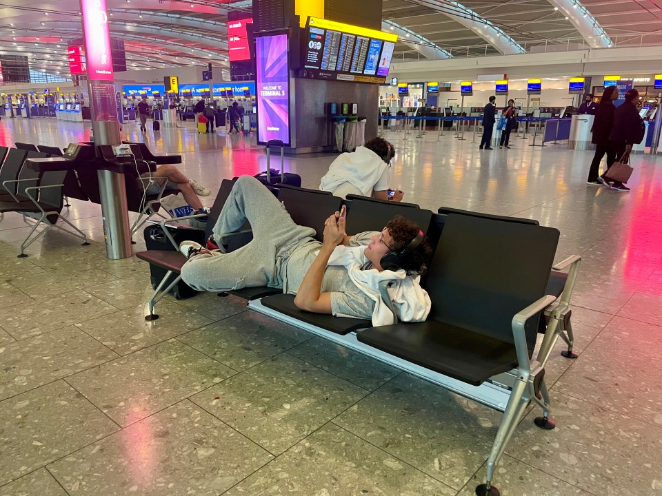 Travellers settling down for the night in Terminal 5