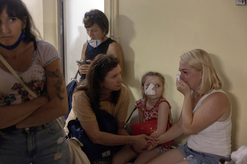 A woman breaking down as people shelter in the basement of the Okhmatdyt Children’s Hospital