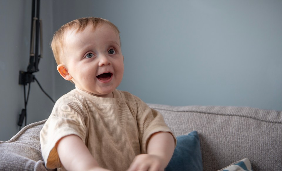 The tot has defied the odds by taking his first steps