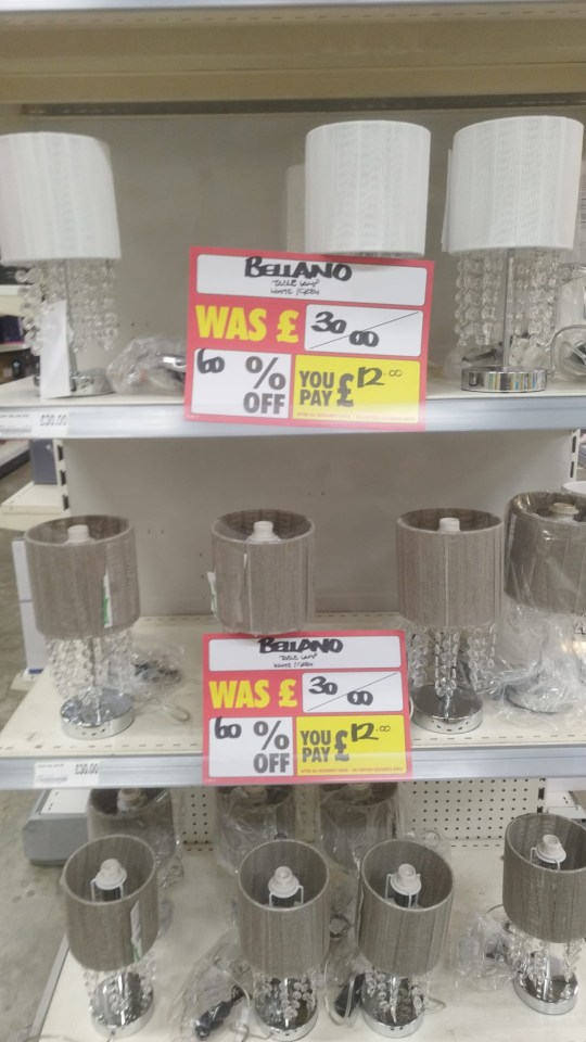 a shelf of lamps with a sign that says bellano on it