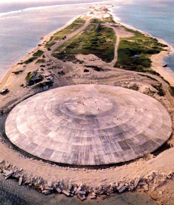 an aerial view of a large dome on a small island