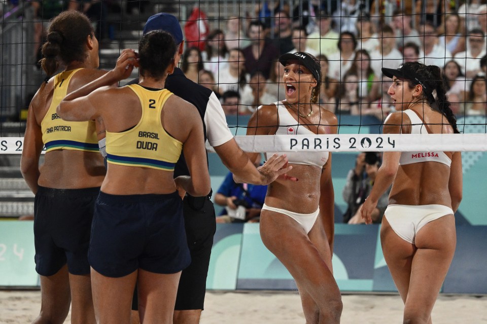 a volleyball player wearing a yellow top with the number 2 on it