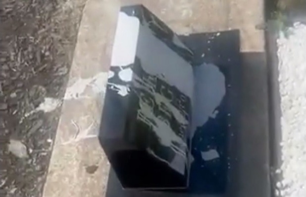 a black box is sitting on top of a concrete surface .