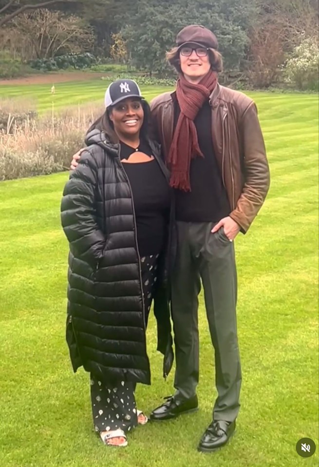 a woman wearing a ny hat stands next to a man