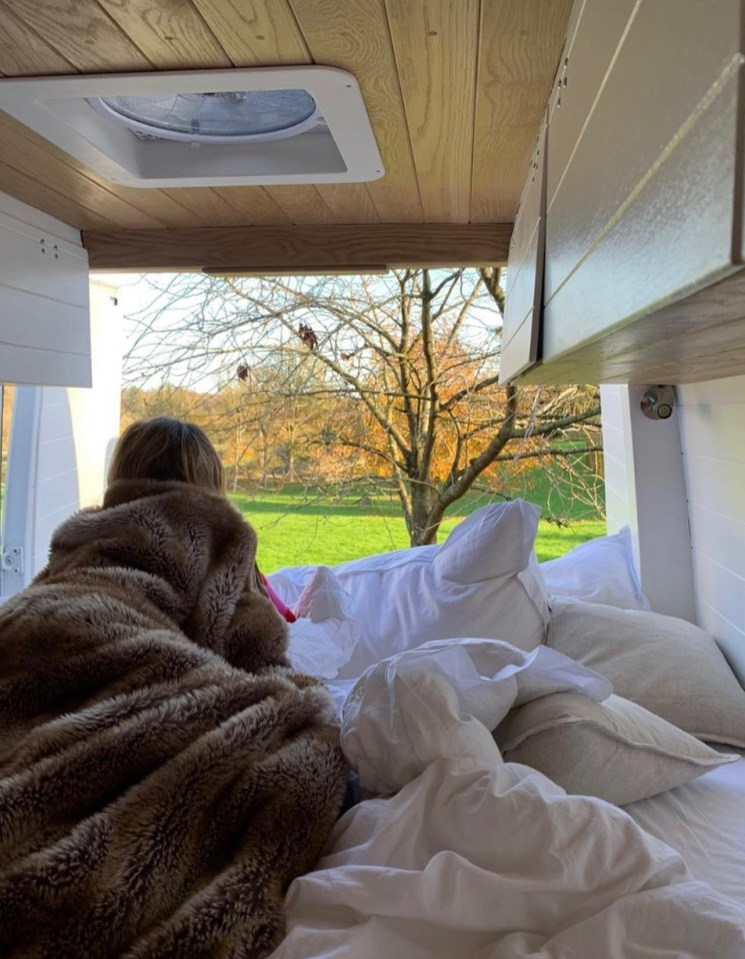 Annabel's bed is right by the van's back doors so they can enjoy the view from bed