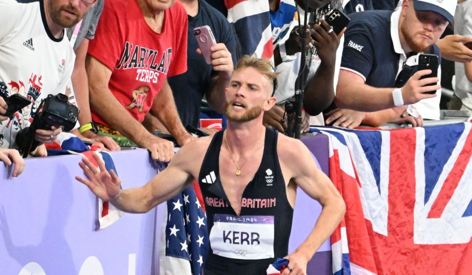 Josh Kerr celebrates with fans after coming second in the 1500m final and winning the silver medal