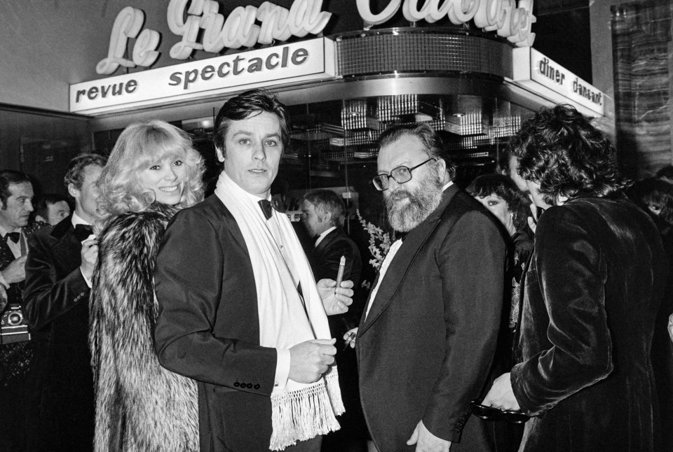 The star posed with actress Mireille Darc and Italian Director Sergio Leone in 1977