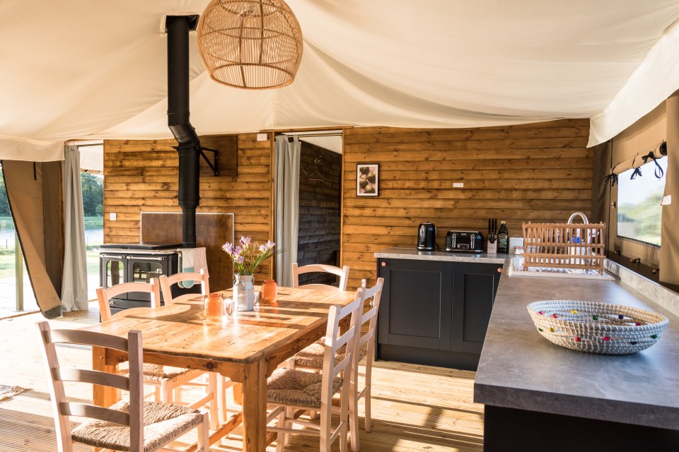 a kitchen with a table and chairs in it