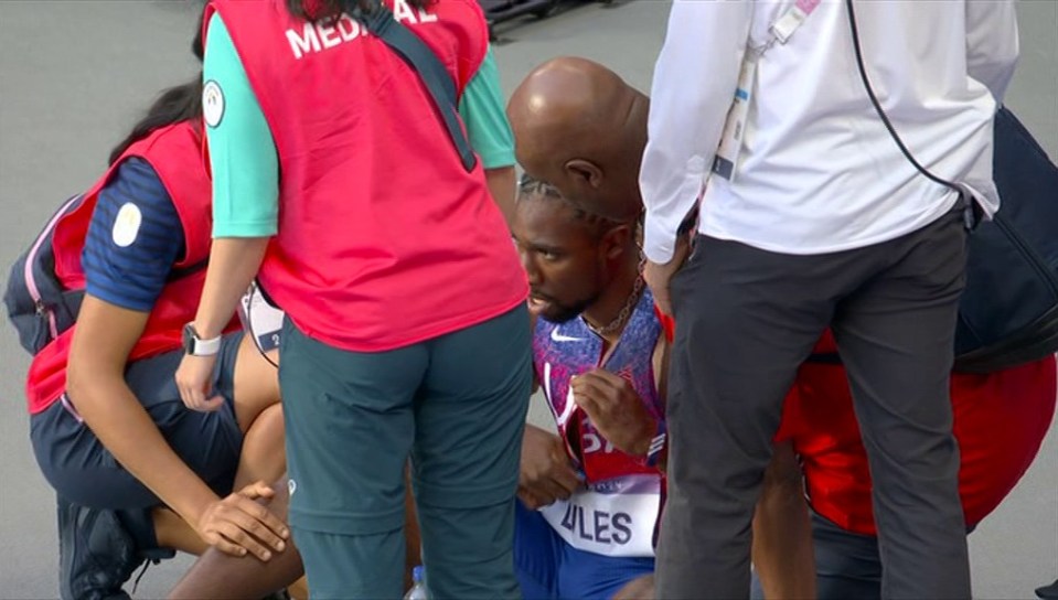 Lyles collapsed to the floor after the race