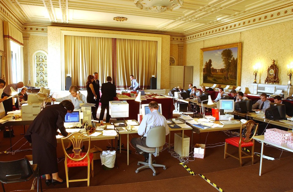 a large room filled with people working on computers