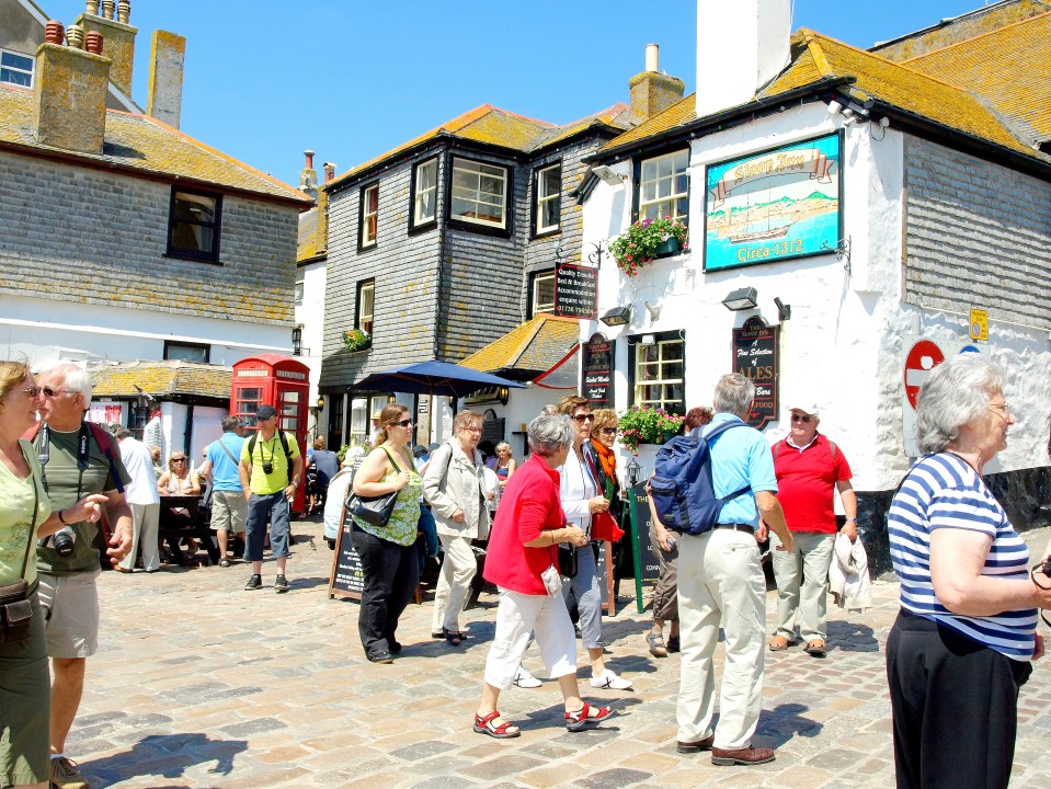 St. Ives, Cornwall in June 2010. The Sloop Inn on the busy quayside