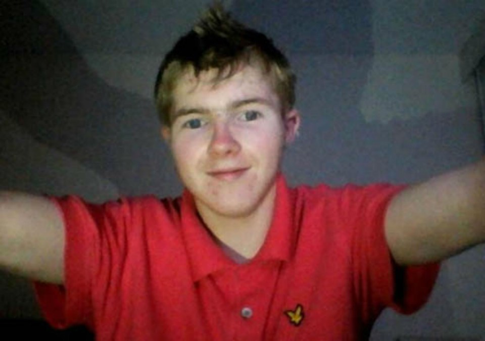 a young man wearing a red lyle & scott polo shirt