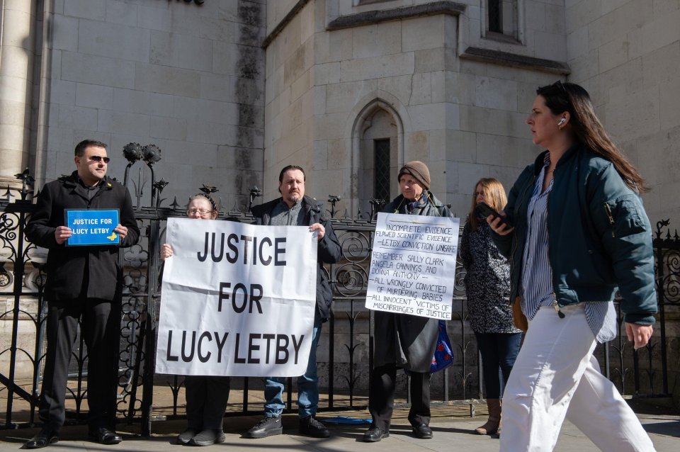 Letby's supporters stand with banners calling for justice outside London's High Court in April