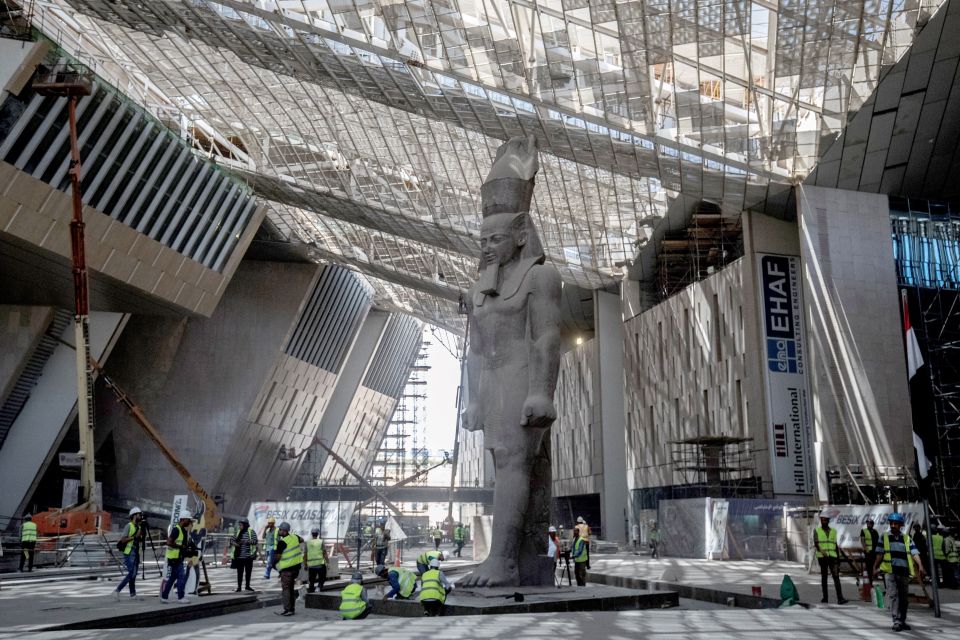 The 3,200-year-old pink-granite colossal statue of King Ramses II at the entrance of the Grand Egyptian Museum