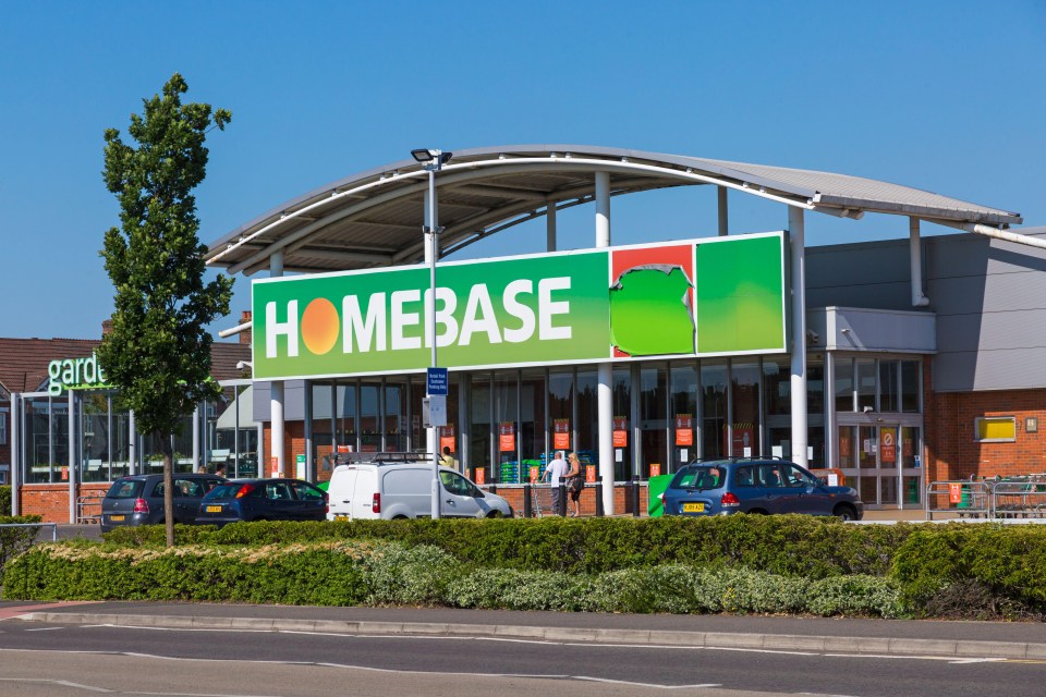 a homebase store with cars parked in front of it